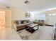 Comfortable living room with neutral decor, tile flooring, and an inviting seating area at 5870 38Th N Ave # 44, St Petersburg, FL 33710