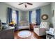 Charming Bedroom featuring hardwood floors, whimsical decor, and ample natural light at 6016 N Dexter Ave, Tampa, FL 33604