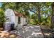 Backyard shed provides additional storage space on a concrete pad in landscaped yard at 6016 N Dexter Ave, Tampa, FL 33604