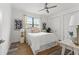 Bright bedroom featuring a ceiling fan, a natural fiber rug, and neutral decor at 6210 64Th N Way, Pinellas Park, FL 33781
