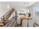 Spacious kitchen and dining area with stairs, modern appliances, and a bright, open concept design at 6210 64Th N Way, Pinellas Park, FL 33781