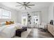 Spacious main bedroom with a neutral color scheme, large windows, and stylish decor, offering a peaceful retreat at 6210 64Th N Way, Pinellas Park, FL 33781