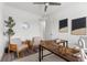 Home office featuring a ceiling fan, hardwood floors, and a U-shaped desk at 6210 64Th N Way, Pinellas Park, FL 33781