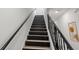 Staircase with painted stairs and decorative iron railings at 6210 64Th N Way, Pinellas Park, FL 33781