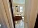 Bathroom featuring a toilet, dark vanity, sink, mirror, and shower with curtain at 6781 121St Ave # H, Largo, FL 33773