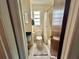 Bright bathroom featuring a toilet, and a shower/tub with curtain at 6781 121St Ave # H, Largo, FL 33773