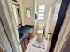 Bright bathroom featuring a toilet, a sink with mirror, and a shower/tub with curtain at 6781 121St Ave # H, Largo, FL 33773