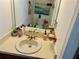 Bathroom featuring a single sink vanity, mirror, and toilet at 6781 121St Ave # H, Largo, FL 33773