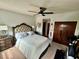 Bedroom featuring closet, painting, exercise bike, and doorway at 6781 121St Ave # H, Largo, FL 33773