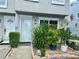 Inviting front entrance features a lovely garden, creating a warm and welcoming atmosphere at 6781 121St Ave # H, Largo, FL 33773