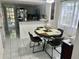 Cozy eat-in kitchen features neutral tile floor and ample natural light at 6781 121St Ave # H, Largo, FL 33773