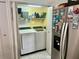 Functional laundry area featuring a modern washer and dryer, and plenty of storage space at 6781 121St Ave # H, Largo, FL 33773