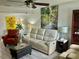 Cozy living room showcasing comfortable seating, stylish decor, and wood-look flooring at 6781 121St Ave # H, Largo, FL 33773