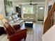 Bright living room with neutral walls, light wood-look floors, and comfortable seating at 6781 121St Ave # H, Largo, FL 33773