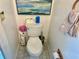 Bright and clean toilet area with essential accessories at 6781 121St Ave # H, Largo, FL 33773