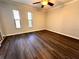 Spacious bedroom with natural light, updated flooring, ceiling fan and ample closet space at 720 Lyndhurst St # 1104, Dunedin, FL 34698