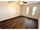 A bedroom featuring neutral walls, updated flooring, a ceiling fan and natural light at 720 Lyndhurst St # 1104, Dunedin, FL 34698