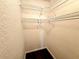 Walk-in closet with built in shelving for storage at 720 Lyndhurst St # 1104, Dunedin, FL 34698