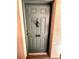 Exterior front door of unit 1104 with a lockbox for convenient access at 720 Lyndhurst St # 1104, Dunedin, FL 34698