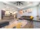 Inviting open-concept living area with stylish decor, an adjacent kitchen, and ample seating at 7683 Summerland Cv, Lakewood Ranch, FL 34202
