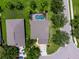 Aerial view of home, highlighting backyard pool area and landscaping in established neighborhood at 8222 Haven Harbour Way, Bradenton, FL 34212