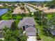 An aerial view showcasing the home's location in a serene community with lush landscaping at 8222 Haven Harbour Way, Bradenton, FL 34212