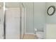 Modern bathroom showcasing a glass-enclosed shower, toilet, and fresh light-green paint at 8222 Haven Harbour Way, Bradenton, FL 34212