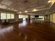 Spacious clubhouse featuring wood flooring, large windows, and mirrored wall for various activities at 8222 Haven Harbour Way, Bradenton, FL 34212