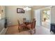 Cozy dining area with a glass table and chairs, adjacent to a sliding glass door leading to a patio at 8222 Haven Harbour Way, Bradenton, FL 34212