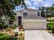 Charming two-story home featuring a neutral color palette, well-manicured landscaping, and a spacious two-car garage at 8222 Haven Harbour Way, Bradenton, FL 34212