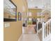 Inviting foyer with soaring ceilings, wood floors, an elegant staircase with white railings, and an upper level at 8222 Haven Harbour Way, Bradenton, FL 34212