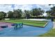 This game area features an assortment of games and a variety of seating areas surrounded by lush landscaping at 8222 Haven Harbour Way, Bradenton, FL 34212