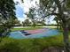 This game area features an assortment of games and a variety of seating areas surrounded by lush landscaping at 8222 Haven Harbour Way, Bradenton, FL 34212