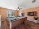 Enjoy hours of fun in this game room, complete with a pool table, dartboard, and natural light at 8222 Haven Harbour Way, Bradenton, FL 34212