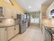 Bright kitchen with granite countertops, stainless steel appliances, tile flooring, and ample cabinet space at 8222 Haven Harbour Way, Bradenton, FL 34212