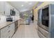 Bright, spacious kitchen features stainless steel appliances, granite countertops, and a unique copper sink at 8222 Haven Harbour Way, Bradenton, FL 34212
