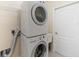 Laundry room with a stacked washer and dryer at 8222 Haven Harbour Way, Bradenton, FL 34212
