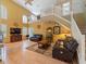 Spacious living room with soaring ceilings, wood floors, large windows, and a comfortable seating area at 8222 Haven Harbour Way, Bradenton, FL 34212