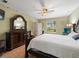 Beautiful main bedroom with wood accents, a large mirror, and a serene color scheme at 8222 Haven Harbour Way, Bradenton, FL 34212