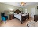Spacious main bedroom with a ceiling fan, wood floors, and decorative accents at 8222 Haven Harbour Way, Bradenton, FL 34212