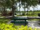 Enjoy a view of the lake from this peaceful picnic area, complete with a picnic table and beautiful foliage at 8222 Haven Harbour Way, Bradenton, FL 34212