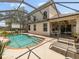 Inviting screened-in pool area perfect for outdoor relaxation and entertaining with seating at 8222 Haven Harbour Way, Bradenton, FL 34212