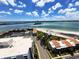 Breathtaking aerial view featuring waterfront condos with a pristine beach and beautiful landscaping at 855 Bayway Blvd # 908, Clearwater Beach, FL 33767