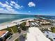 Expansive aerial view highlighting waterfront condos with beach access near the bridge at 855 Bayway Blvd # 908, Clearwater Beach, FL 33767