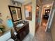 Bathroom featuring a vanity with granite countertop and a tiled shower with a glass door at 855 Bayway Blvd # 908, Clearwater Beach, FL 33767