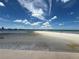 Scenic view of the white sand beach, blue skies, and Tampa Bay waters at 855 Bayway Blvd # 908, Clearwater Beach, FL 33767