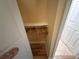 Walk-in closet featuring hanging storage and wood-look flooring, providing ample space for organization at 855 Bayway Blvd # 908, Clearwater Beach, FL 33767