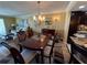 Inviting dining room featuring a wooden table set under a chandelier, perfect for Gathering gatherings at 855 Bayway Blvd # 908, Clearwater Beach, FL 33767