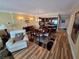Open-concept dining area, featuring a dining table with seating for six, seamlessly flowing into the kitchen at 855 Bayway Blvd # 908, Clearwater Beach, FL 33767