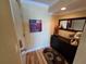 Unit entryway boasts wood flooring, decorative mirror, wall art, storage console, and a sunflower rug at 855 Bayway Blvd # 908, Clearwater Beach, FL 33767